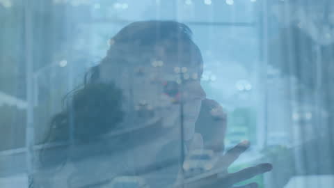 Cityscape Animation Over Businesswoman Using Smartphone