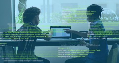 Developers collaborating and reviewing code on laptop with code overlay in glass room
