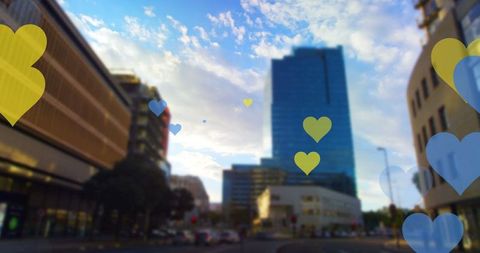 Yellow and blue hearts over cityscape reflects global solidarity