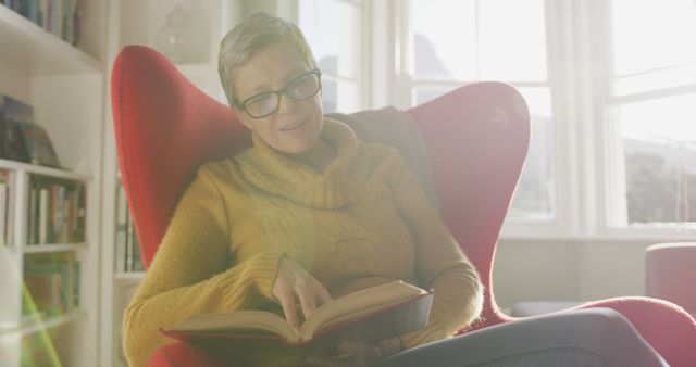 Senior Woman Reading Book in Bright Cozy Living Room - Download Free Stock Images Pikwizard.com