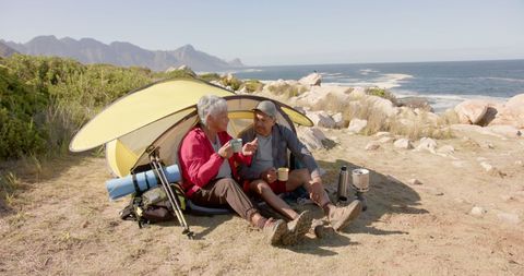 Senior Couple Enjoying Camping by the Sea with Scenic View