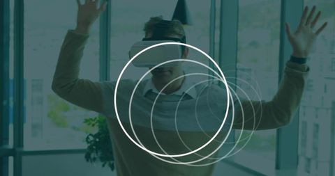 Man with vr headset engaging with virtual interface in office environment