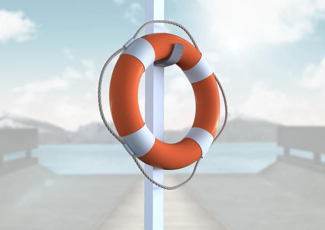 Lifebuoy hanging on pole by waterfront with blurred background of water and mountains. Ideal for illustrating safety measures, emergency preparedness, maritime activities, and outdoor adventures.