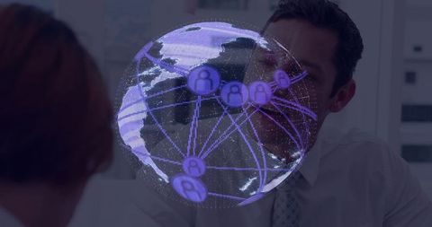 Holographic globe in futuristic corporate meeting