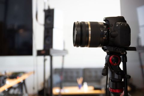Professional photography technology camera on tripod in studio