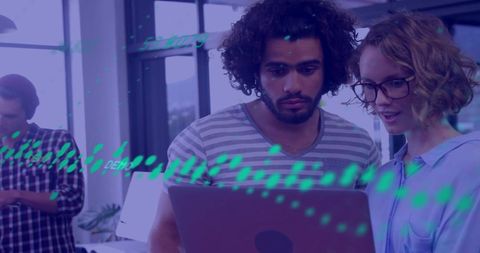 Professionals Analyzing Financial Data in Modern Office