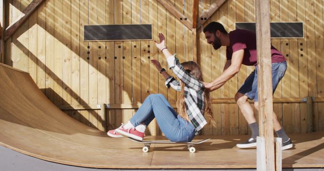 Image of happy diverse female and male skateboarders having fun in skate park. Skateboarding, sport, active lifestyle and hobby concept.