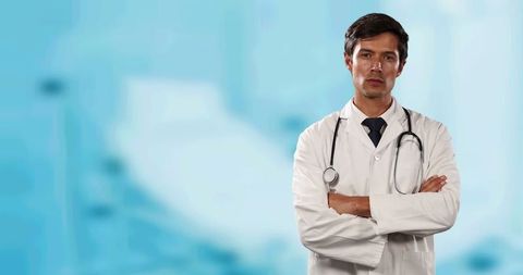 Confident male doctor in hospital setting with stethoscope