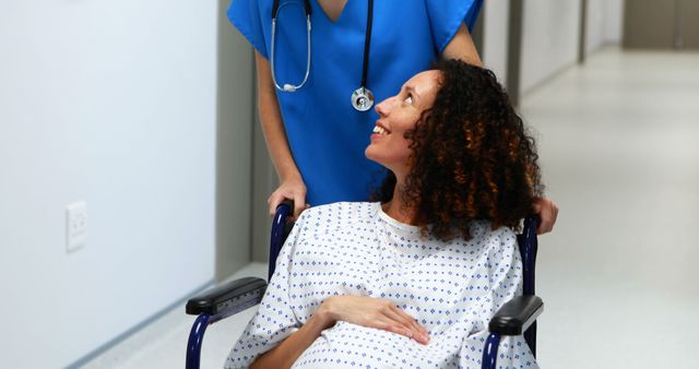  Pregnant woman in wheelchair getting medical assistance from nurse - Download Free Stock Images Pikwizard.com