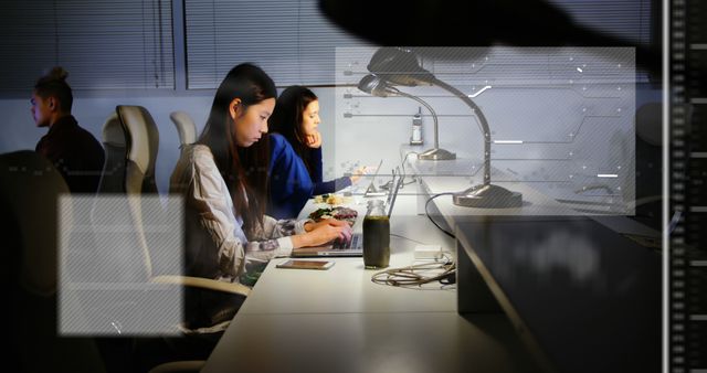 Focused Professionals Working Late in Modern Office - Download Free Stock Images Pikwizard.com