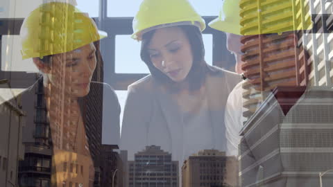 Engineers Collaborating on Construction Project with City Overlay