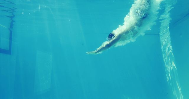 Underwater View of Swimmer Diving in Pool - Download Free Stock Images Pikwizard.com
