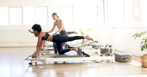 Women Pilates Reformer Class in Sunlit Fitness Studio - Download Free Stock Images Pikwizard.com