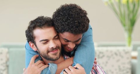 Interracial Friendship Between Two Young Men Hugging