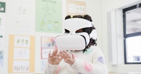 Young Girl Engaging with Virtual Reality in Educational Setting