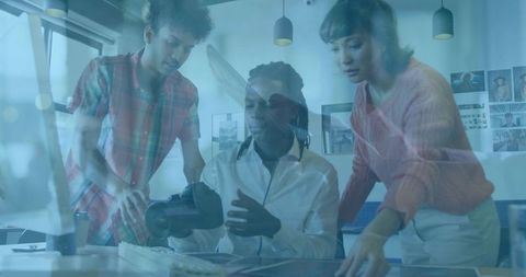 Team Collaborating in Modern Office with Virtual Reality Headset