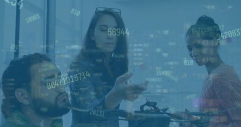 Engineers Analyzing Quadcopter with Data Overlay in Modern Workspace