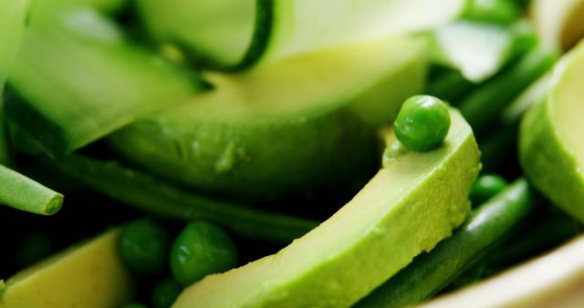 Close-up of Fresh Green Salad with Avocado Slices and Peas - Download Free Stock Images Pikwizard.com