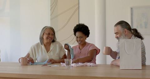 Family Sharing Joyful Gift Giving Experience at Home