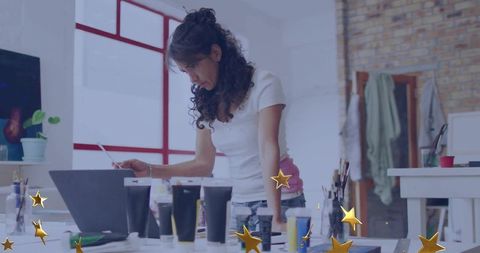 Mature artist engaged in creative process at studio workspace