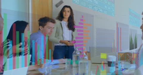 Diverse Team Analyzing Financial Data in Modern Office