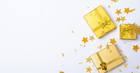 Golden Gift Boxes and Sparkling Stars on White Background - Download Free Stock Images Pikwizard.com