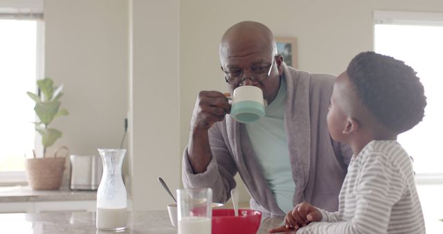 Grandfather and Grandson Enjoying Breakfast Together in Cozy Kitchen - Download Free Stock Images Pikwizard.com