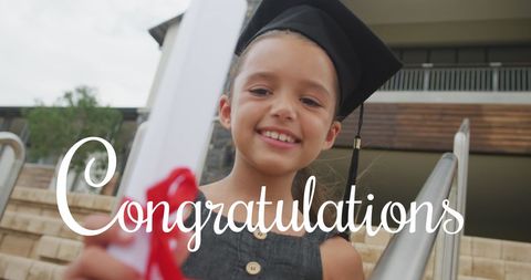 Happy Schoolgirl Holding Diploma in Graduation Cap Celebrating Achievement