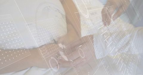 Reclining woman interacting with holographic keyboard on bed for smart home interface