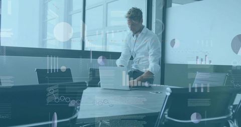 Executive Checking Laptop in Modern Boardroom with Data Visualization Overlay
