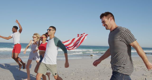 Group of cheerful friends running along the beach, carrying an American flag. Ideal for themes related to summer holidays, national celebrations, friendship, patriotism, and outdoor fun. Can be used for advertisements, travel brochures, social media posts, and summer event promotions.
