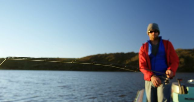 Fisherman Casting Rod on Serene Lake at Sunset - Download Free Stock Images Pikwizard.com