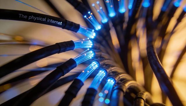 Glowing fiber optic bundle emitting blue light, macro network cables and connectivity
