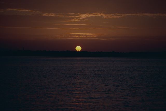 Golden Sunset Over Calm Ocean Waters - Download Free Stock Photos Pikwizard.com