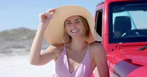 Smiling Woman Enjoying Road Trip by Sea with Vibrant Outfit - Download Free Stock Images Pikwizard.com