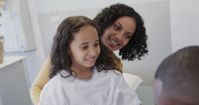 Doctor Speaking with Young Girl and Her Mother in Hospital Room - Download Free Stock Images Pikwizard.com