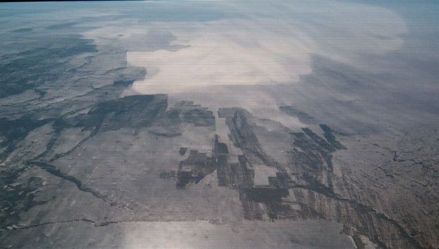 Breathtaking Aerial View of Patterns Across Expansive Farmland and Desert