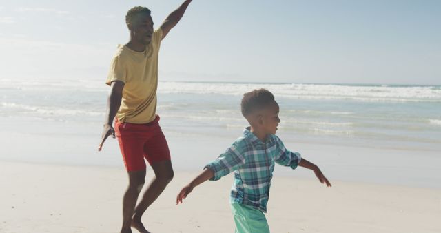 Father and Son Enjoying Quality Time at the Beach - Download Free Stock Images Pikwizard.com