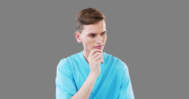 Young Male Nurse Pondering Serious Thoughts in Scrubs - Download Free Stock Images Pikwizard.com