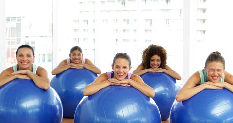 Diverse Group Enjoying Fitness Class with Exercise Balls in Studio - Download Free Stock Images Pikwizard.com