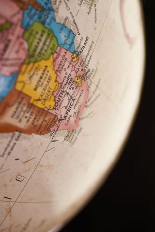 Vintage globe highlighting South Africa Lesotho Eswatini close-up travel exploration concept