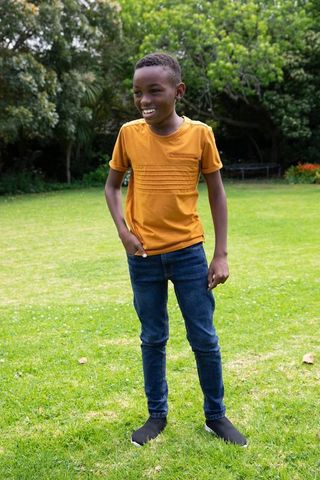 Joyful African American Boy Wearing Mustard Shirt While Outdoor
