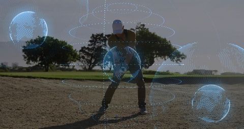 Golfer practicing bunker shot with augmented holographic orbit overlay on sunlit course