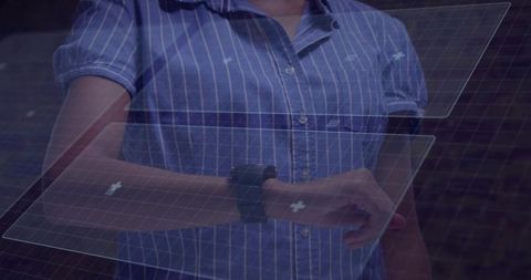 Wearing smartwatch interacting with holographic health interface panels over striped shirt