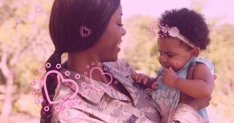 African American Soldier Mother's Tender Moment with Baby