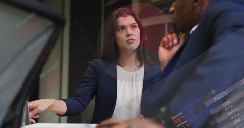 Diverse Business Team Discussing Data Reports and Infographics