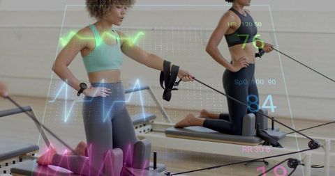 Wearable-tracked pilates reformer class with biometric overlays and smartwatch data