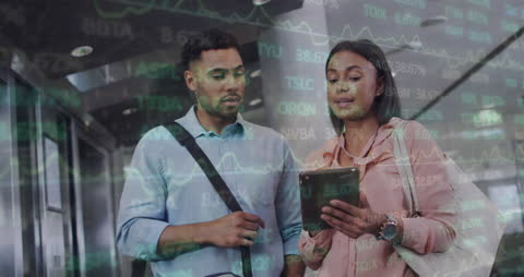 Business Professionals Analyzing Stock Market Data on Tablet