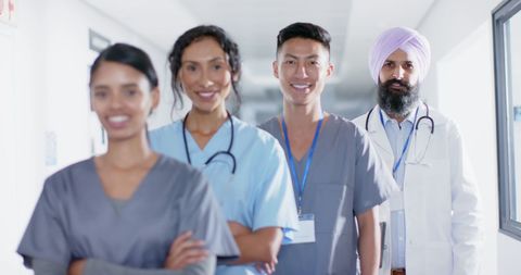 Diverse Medical Team Posing in Hospital Corridor - Download Free Stock Images Pikwizard.com