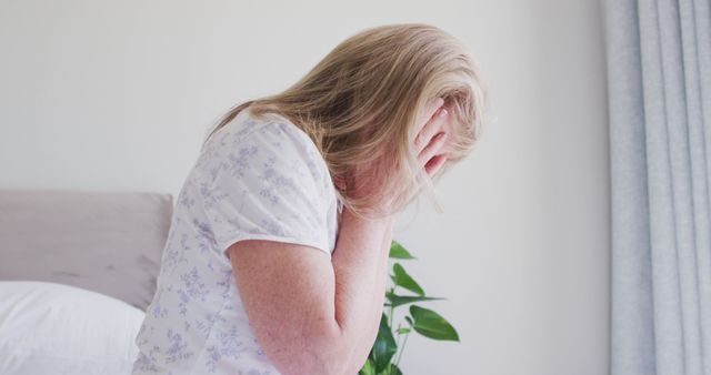 Senior Woman Sitting on Bed in Dramatic Emotion - Download Free Stock Images Pikwizard.com